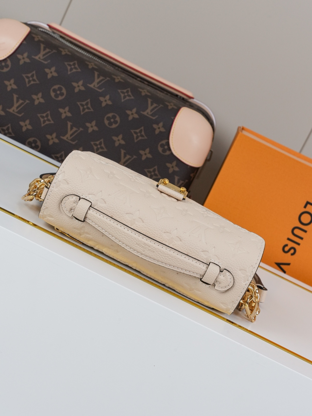 Designer Pochette Métis East West Embossed Soft Grain Cowhide - Crème Beige - Gorchic - $116.99